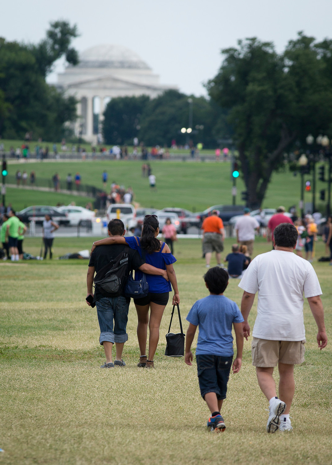 People walk near the Jefferson Memorial in Washington Aug. 10, 2017. “Dreamers,” as beneficiaries of the Deferred Action for Childhood Arrivals are best known, have joined their voices with those of other Hispanic immigrants taking part in the U.S. Catholic Church’s encuentro process.